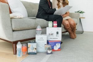 Expert helping pregnant mom review her baby registry checklist with recommended baby products