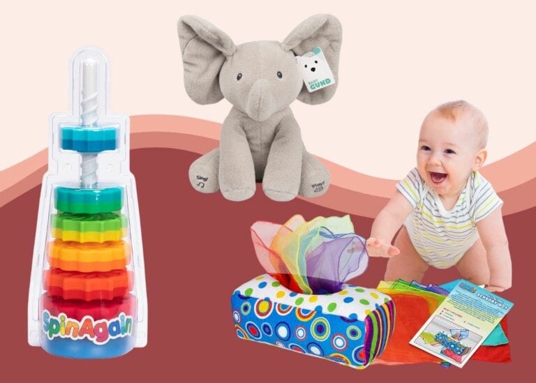 A baby is crawling towards a soft, colorful tissue box toy. To the left, there is a toy with interlocking rings stacked on a spiral pole labeled "SpinAgain" – one of the best toys for 6-9 months. An elephant stuffed animal with a tag is placed behind the baby.