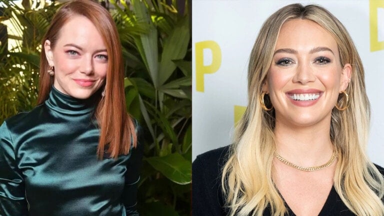 Two women are pictured side by side in this image. The woman on the left has red hair, wears a dark green satin top, and stands in front of greenery. The woman on the right, resembling Hilary Duff, has blonde hair, wears a black top, and stands against a backdrop with yellow letters.