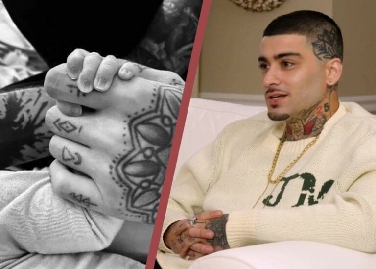 The image is divided into two sections. The left side shows a close-up of tattooed hands holding a baby's feet. The right side shows Zayn Malik with tattoos and short hair, wearing a white sweater, seated on a white couch and engaged in conversation.